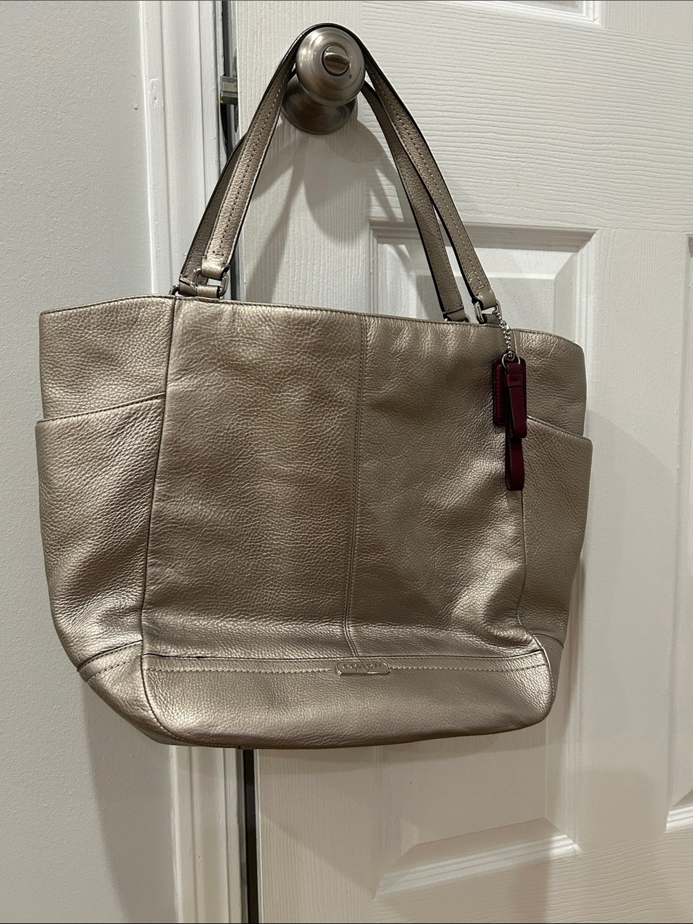 Coach Metallic Champagne Tote with Burgundy Charm